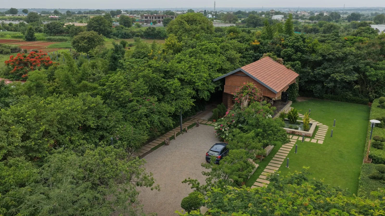 Aerial view of the pavilion and planted grounds at Woods Shamshabad